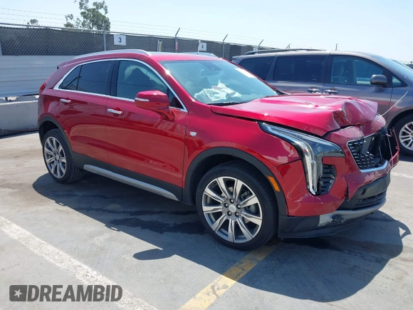 2021 Cadillac XT4 FWD Premium Luxury z VIN 1GYFZCR48MF004849, wystawiony jako IAAI lot #42131896 z przebiegiem 9 864 mil mil oraz . Historia ofert i sprzedaży dostępna na DreamBid. Obrazek 1.