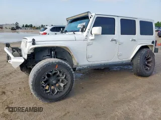 2015 Jeep Wrangler Unlimited Sport with VIN 1C4BJWDG9FL759012, listed as a Copart auction lot 61002465 with 101,395 mi miles and Salvage title. Bid and sale history available at DreamBid. Image 1.
