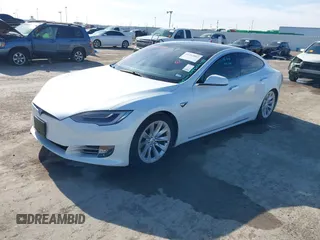 2020 Tesla Model S Long Range with VIN 5YJSA1E23LF360441, listed as a IAAI auction lot 41312865 with 68,967 mi miles and . Bid and sale history available at DreamBid. Image 2.