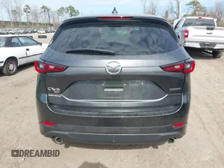 2024 Mazda CX-5 S Premium z VIN JM3KFBDLXR0486618, wystawiony jako IAAI lot #42055952 z przebiegiem 4559 mil mil oraz . Historia ofert i sprzedaży dostępna na DreamBid. Obrazek 16.