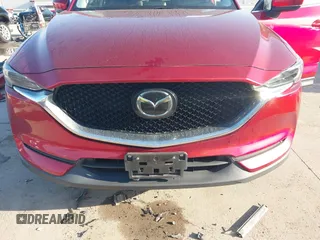 2020 Mazda CX-5 Grand Touring with VIN JM3KFADM7L0729537, listed as a IAAI auction lot 41864569 with 82,998 mi miles. Bid and sale history available at carsss.com. Image 13.