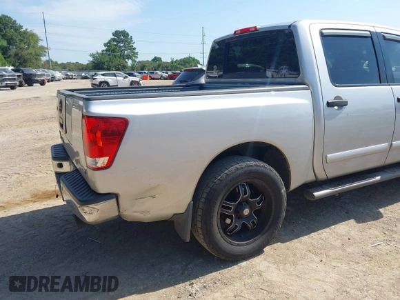 2012 Nissan Titan SV with VIN 1N6BA0ED8CN320723, listed as a IAAI auction lot 42642482 with 214,941 mi miles and . Bid and sale history available at DreamBid. Image 6.