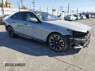 2024 BMW 5 Series 530i with VIN WBA43FJ06RCP67824, listed as a Copart auction lot 61351965 with 12,990 mi miles and Salvage title. Bid and sale history available at DreamBid. Image 4.
