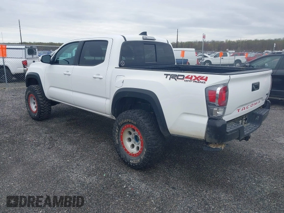 2023 Toyota Tacoma SR with VIN 3TMCZ5AN2PM641846, listed as a IAAI auction lot 41948660 with 21,969 mi miles and . Bid and sale history available at DreamBid. Image 3.