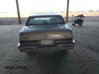 1991 Cadillac Seville z VIN 1G6KS53B5MU825563, wystawiony jako Copart lot #81541154 z przebiegiem 93 284 mil mil oraz Czysty tytuł • Clean title. Historia ofert i sprzedaży dostępna na DreamBid. Obrazek 6.