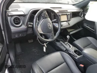 2018 Toyota RAV4 Hybrid SE z VIN JTMJJREV0JD246230, wystawiony jako Copart lot #89095135 z przebiegiem Nie podano mil oraz Szkoda całkowita • Salvage title. Historia ofert i sprzedaży dostępna na DreamBid. Obrazek 8.