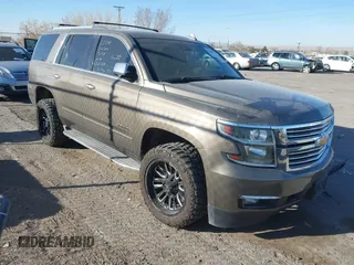 2015 Chevrolet Tahoe LTZ z VIN 1GNSKCKC5FR542430, wystawiony jako IAAI lot #41560671 z przebiegiem 156 890 mil mil oraz . Historia ofert i sprzedaży dostępna na DreamBid. Obrazek 1.