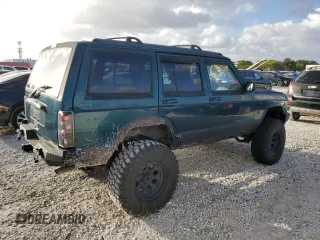 1998 Jeep Cherokee Country with VIN 1J4FT78S8XL520854, listed as a Copart auction lot 79304214 with 111,674 mi miles and Clean title. Bid and sale history available at DreamBid. Image 3.
