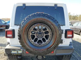 2022 Jeep Wrangler Unlimited Rubicon with VIN 1C4JJXFG2NW125360, listed as a Copart auction lot 76773624 with 22,978 mi miles and Salvage title. Bid and sale history available at DreamBid. Image 6.