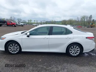 2019 Toyota Camry LE z VIN 4T1B11HK8KU819721, wystawiony jako IAAI lot #42127411 z przebiegiem 101 333 mil mil oraz . Historia ofert i sprzedaży dostępna na DreamBid. Obrazek 15.