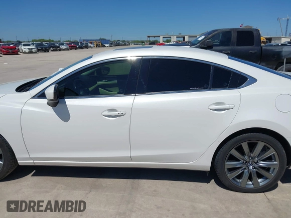 2021 Mazda 6 Touring with VIN JM1GL1VM4M1618686, listed as a IAAI auction lot 42079730 with 55,539 mi miles and . Bid and sale history available at DreamBid. Image 14.