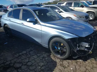 2015 BMW 3 Series 328i xDrive with VIN WBA3B3C53FJ984051, listed as a IAAI auction lot 40878423 with NaN miles. Bid and sale history available at carsss.com. Image 1.