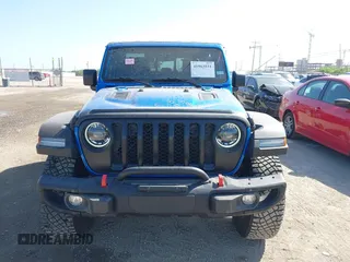 2023 Jeep Gladiator Rubicon with VIN 1C6JJTBG3PL581023, listed as a IAAI auction lot 41963931 with 15,023 mi miles and . Bid and sale history available at DreamBid. Image 13.