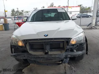 2015 BMW X1 sDrive28i with VIN WBAVM1C53FV318663, listed as a IAAI auction lot 41711526 with 182,204 mi miles. Bid and sale history available at carsss.com. Image 6.