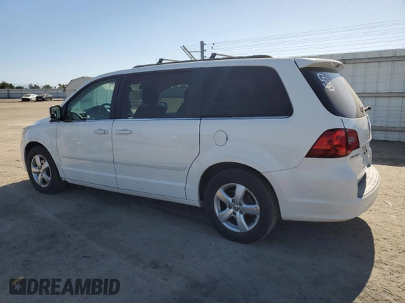2011 Volkswagen Routan SE with VIN 2V4RW3DG5BR739944, listed as a Copart auction lot 56787495 with 84,932 mi miles and Salvage title. Bid and sale history available at DreamBid. Image 2.