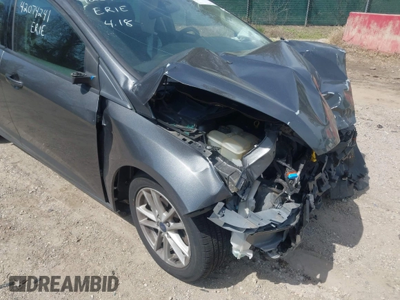 2017 Ford Focus SE with VIN 1FADP3F20HL335881, listed as a IAAI auction lot 42074241 with 127,741 mi miles. Bid and sale history available at carsss.com. Image 13.