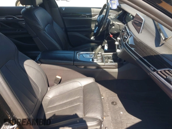 2019 BMW 7 Series 740i xDrive with VIN WBA7E4C57KGV70521, listed as a IAAI auction lot 41881538 with 114,480 mi miles and . Bid and sale history available at DreamBid. Image 5.