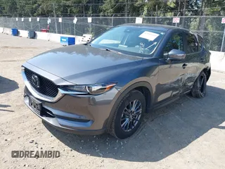 2020 Mazda CX-5 Touring with VIN JM3KFBCM6L1828691, listed as a IAAI auction lot 42100409 with 25,182 mi miles. Bid and sale history available at carsss.com. Image 22.