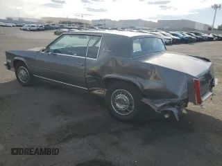 1985 Cadillac Eldorado z VIN 1G6EL5786FE628861, wystawiony jako Copart lot #76372384 z przebiegiem 15 146 mil mil oraz Szkody całkowita. Historia ofert i sprzedaży dostępna na DreamBid. Obrazek 2.
