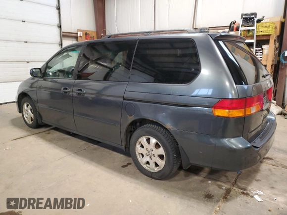 2003 Honda Odyssey EX with VIN 2HKRL18603H008412, listed as a Copart auction lot 87502365 with 352,773 mi miles and Salvage Title. Bid and sale history available at DreamBid. Image 2.