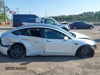 2023 Tesla Model 3 with VIN 5YJ3E1EA9PF557880, listed as a IAAI auction lot 42481413 with 40,582 mi miles and . Bid and sale history available at DreamBid. Image 12.