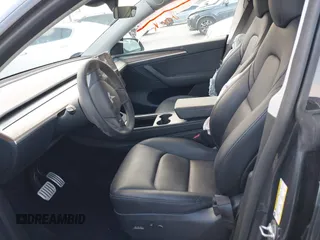 2023 Tesla Model Y Performance with VIN 7SAYGDEF6PF837174, listed as a IAAI auction lot 41436629 with 22,799 mi miles and . Bid and sale history available at DreamBid. Image 5.