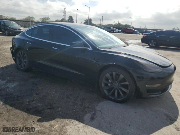 2018 Tesla Model 3 Long Range Battery with VIN 5YJ3E1EA8JF029772, listed as a Copart auction lot 87679835 with 67,828 mi miles and Clean Title. Bid and sale history available at carsss.com. Image 4.