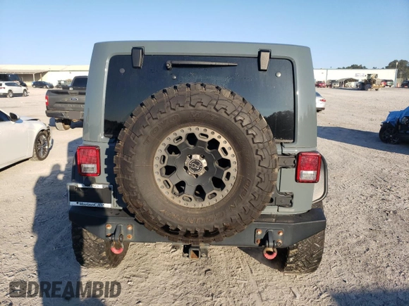 2013 Jeep Wrangler Unlimited Rubicon 10th Anniversary z VIN 1C4HJWFG0DL704100, wystawiony jako Copart lot #75573634 z przebiegiem 103 158 mil mil oraz Szkoda całkowita • Salvage title. Historia ofert i sprzedaży dostępna na DreamBid. Obrazek 6.
