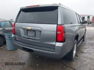 2019 Chevrolet Suburban LT with VIN 1GNSKHKCXKR405555, listed as a IAAI auction lot 42188860 with 143,435 mi miles and . Bid and sale history available at DreamBid. Image 4.
