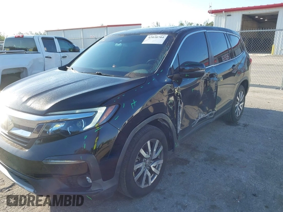 2021 Honda Pilot EX-L with VIN 5FNYF5H55MB044677, listed as a IAAI auction lot 42038704 with 38,684 mi miles and . Bid and sale history available at carsss.com. Image 6.
