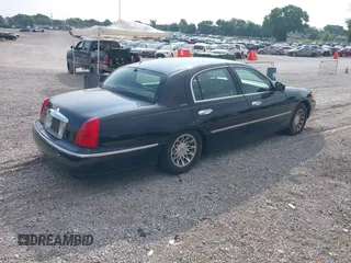 2001 Lincoln Town Car Signature with VIN 1LNHM82W11Y613959, listed as a IAAI auction lot 42432229 with 144,660 mi miles and . Bid and sale history available at DreamBid. Image 4.