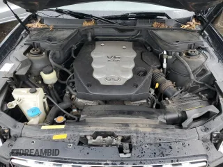 2005 Infiniti FX z VIN JNRAS08W05X217666, wystawiony jako Copart lot #37808544 z przebiegiem 172 472 mil mil oraz Szkoda całkowita • Salvage title. Historia ofert i sprzedaży dostępna na DreamBid. Obrazek 11.