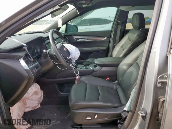 2024 Cadillac XT6 FWD Luxury with VIN 1GYKPAR41RZ700452, listed as a Copart auction lot 57675945 with 27,449 mi miles and Salvage title. Bid and sale history available at DreamBid. Image 7.
