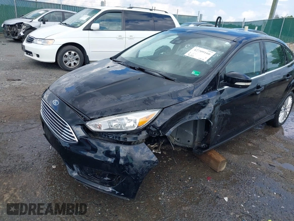 2016 Ford Focus Titanium z VIN 1FADP3J27GL215436, wystawiony jako IAAI lot #42709166 z przebiegiem 75 956 mil mil oraz . Historia ofert i sprzedaży dostępna na DreamBid. Obrazek 6.