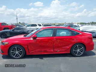 2023 Honda Civic Touring with VIN 2HGFE1F94PH323451, listed as a IAAI auction lot 42383422 with 6,120 mi miles and . Bid and sale history available at DreamBid. Image 6.