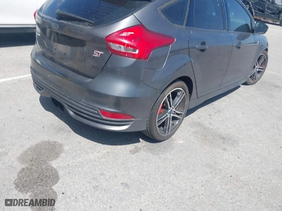 2015 Ford Focus ST with VIN 1FADP3L94FL241243, listed as a IAAI auction lot 41964511 with 97,259 mi miles. Bid and sale history available at carsss.com. Image 4.