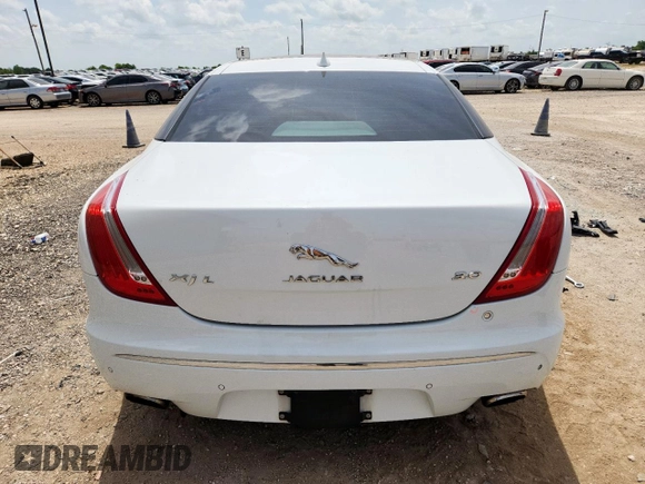 2015 Jaguar XJ Portfolio with VIN SAJWA2GZ7F8V82990, listed as a Copart auction lot 63325535 with 113,892 mi miles and Salvage title. Bid and sale history available at DreamBid. Image 6.