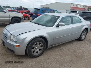 2006 Chrysler 300 Touring with VIN 2C3KA53GX6H113815, listed as a IAAI auction lot 42149912 with 144,813 mi miles. Bid and sale history available at carsss.com. Image 2.