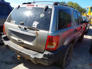 1999 Jeep Grand Cherokee Laredo with VIN 1J4GW58S0XC678864, listed as a IAAI auction lot 37593033 with Not provided miles and . Bid and sale history available at DreamBid. Image 4.