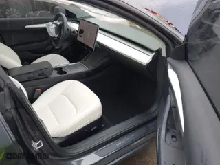 2022 Tesla Model 3 Long Range with VIN 5YJ3E1EBXNF138538, listed as a IAAI auction lot 41771647 with 31,250 mi miles. Bid and sale history available at carsss.com. Image 5.