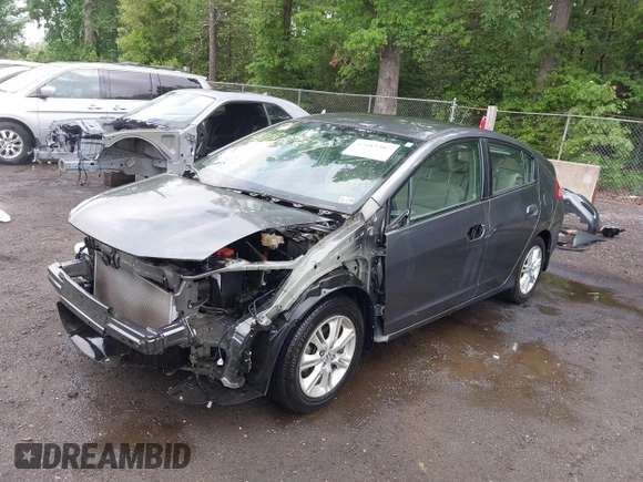 2010 Honda Insight EX with VIN JHMZE2H73AS025856, listed as a IAAI auction lot 42183307 with 71,564 mi miles and . Bid and sale history available at DreamBid. Image 2.