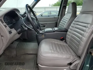 1999 Ford Explorer XL z VIN 1FMZU34X6XUC27678, wystawiony jako Copart lot #57073105 z przebiegiem 228 525 mil mil oraz Czysty tytuł • Clean title. Historia ofert i sprzedaży dostępna na DreamBid. Obrazek 7.