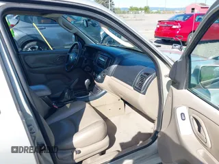 2005 Mazda Tribute S with VIN 4F2CZ96105KM04032, listed as a IAAI auction lot 42157429 with 199,704 mi miles and . Bid and sale history available at carsss.com. Image 5.