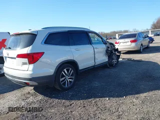 2016 Honda Pilot Touring with VIN 5FNYF6H98GB017079, listed as a IAAI auction lot 42055272 with 142,726 mi miles and . Bid and sale history available at DreamBid. Image 4.