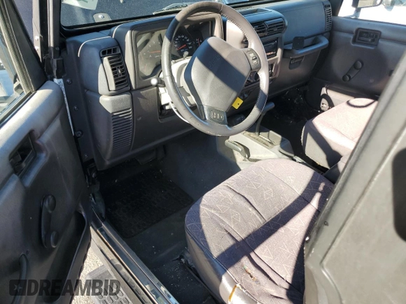 2001 Jeep Wrangler Sport with VIN 1J4FA49S21P339042, listed as a Copart auction lot 56922555 with 113,315 mi miles and Salvage title. Bid and sale history available at DreamBid. Image 8.