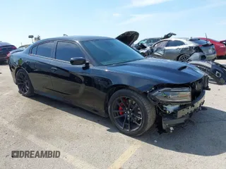2023 Dodge Charger Scat Pack Widebody with VIN 2C3CDXGJ5PH697779, listed as a IAAI auction lot 41827418 with 9,963 mi miles. Bid and sale history available at carsss.com. Image 1.