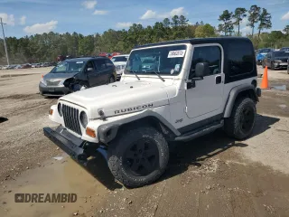 2003 Jeep Wrangler Rubicon z VIN 1J4FA69S73P333199, wystawiony jako Copart lot #50602615 z przebiegiem 133 254 mil mil oraz Szkoda całkowita • Salvage title. Historia ofert i sprzedaży dostępna na DreamBid. Obrazek 1.