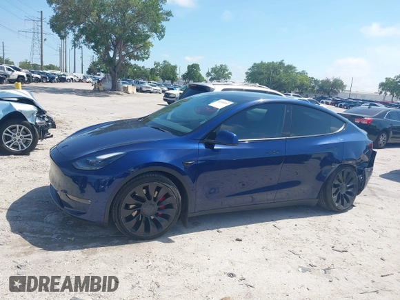 2023 Tesla Model Y Performance with VIN 7SAYGDEF9PF582908, listed as a IAAI auction lot 41930957 with 52,857 mi miles and . Bid and sale history available at DreamBid. Image 13.