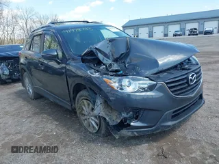 2016 Mazda CX-5 Touring with VIN JM3KE4CYXG0620990, listed as a IAAI auction lot 41978738 with 91,237 mi miles and . Bid and sale history available at carsss.com. Image 6.