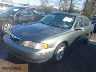 1998 Mazda 626 DX with VIN 1YVGF22C4W5768778, listed as a IAAI auction lot 41971066 with 119,168 mi miles. Bid and sale history available at carsss.com. Image 2.
